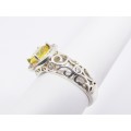 A Gorgeous Halo Design Ring With a Striking Yellow Zirconia in Sterling Silver