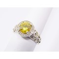 A Gorgeous Halo Design Ring With a Striking Yellow Zirconia in Sterling Silver