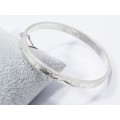 A Beautiful Engraved Vintage Design Hinged Bangle in Sterling Silver.