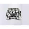 A Lovely Broad Ring Set with Pave Black Stones in Sterling Silver