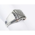 A Lovely Broad Ring Set with Pave Black Stones in Sterling Silver