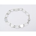 A Stunning Heart Cut Out Design Bracelet in Sterling Silver.