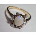18 ct yellow and white gold diamond and opal ring.