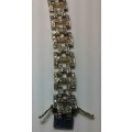 ** VALUE R73,000 ** Lady's Tennis solid 9ct Gold and Diamond bracelet