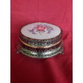 A petit point embroidered powder box