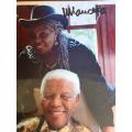 Nelson Mandela & Miriam Makeba laminated photo, signed by President Nelson Mandela (with COA)