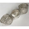 Solid silver decorative napkin rings and spoons