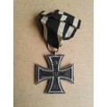 The second Iron Cross with the date of 1813 has FW for Kaiser Friedrich Wilhelm III of Prussia who i