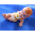 Retro small (printer`s tray sized} dolls. Baby wearing a nappy