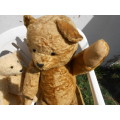 Retro, large (700mm high), straw-filled teddy bear with a small modern friend.