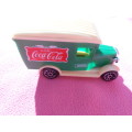 Small, plastic Coca-cola truck.