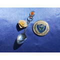 SAA Museum spoon, Hoerskool Jeugland disc and Natal Sport Club badge joblot.