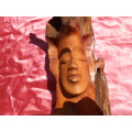 Wooden carving.  Man in a tree.