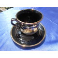 Small cup and saucer, stamped: D. Strigos.  24k gold trim.  Made in Greece.
