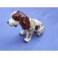 Porcelain dog.  No markings.