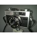 Vintage Ricoh 500G camera with adjustable lense. Auto timer. Still in working order.