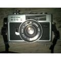 Vintage Ricoh 500G camera with adjustable lense. Auto timer. Still in working order.