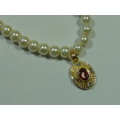 Vintage pearl bead Necklace with gold tone Pendant and red stone