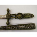 Vintage metal paper knife in the shape of a sword / dagger