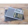 Vintage Sony world Receiver Radio in original pouch and in working condition, 3.5cm x 12cm x 18cm