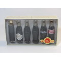 1999 Boxed set of 6 Coca Cola miniature glass Bottles.Evolution of the contour bottle 1899-1999 mint