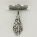 Early Sterling Silver `Stork` Baby Food Pusher