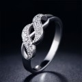 RADIANT! Cross Over Infinity Ring With 12 0,25ct Simulated Diamonds Size 8; 9 US