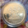 RSA Proof 1986 Johannesburg Centenary Silver One Rand in capsule