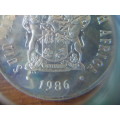 1986 Springbok Silver Rand Proof Coin. Rainbow toning