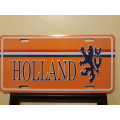 A Holland Plaque (Metal) and an Amsterdam Picture in Frame