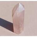 A 400G ROSE QUARTZ OBELISK WITH A 6 FACETTED POINT  CUT AND POLISHED IN ZAMBIA