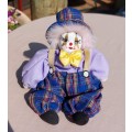 CREEPY CLOWN DOLL WITH PLASTIC FACE AND SAWDUST FILLED BODY