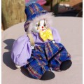 CREEPY CLOWN DOLL WITH PLASTIC FACE AND SAWDUST FILLED BODY