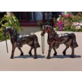 PAIR OF BRONZE OR COPPER COWBOY STYLE HORSES WITH BEADED CHAIN RAINS AND MOLDED SADDLES