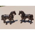 PAIR OF BRONZE OR COPPER COWBOY STYLE HORSES WITH BEADED CHAIN RAINS AND MOLDED SADDLES