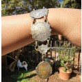 VINTAGE 1950S DON QUIXOTE MEDIEVAL KNIGHT AND GLADIATOR EMBOSSED BRASS CUFF BRACELET