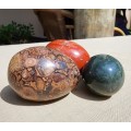 THREE COLOURFUL ALABASTER, MARBLE OR ROCK EGGS