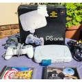 A MIGHTY PS ONE BUNDLE WORKING: CONSOLE WITH DUAL SHOCK CONTROLLER, MEMORY CARD AND TWO GAMES