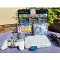 A MIGHTY PS ONE BUNDLE WORKING: CONSOLE WITH DUAL SHOCK CONTROLLER, MEMORY CARD AND TWO GAMES
