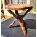 ORIENTAL TEAK COFFEE TABLE  CIRCULAR TOP WITH CARVED FLORAL BORDER AND FOLDING TRIPOD FEET