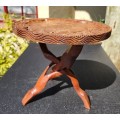 ORIENTAL TEAK COFFEE TABLE  CIRCULAR TOP WITH CARVED FLORAL BORDER AND FOLDING TRIPOD FEET