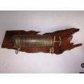 Fireextinguisher mounted on piece of Olienwood