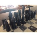 Soap stone chess set and board.