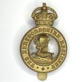 The Hertfordshire regiment cap badge with slide