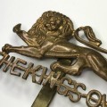 The Kings own Royal Lancaster regiment cap badge with slide