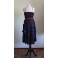 1970s black chiffon party dress with red contrasting detail