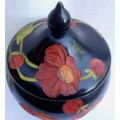 BEAUTIFUL HAND CARVED AND PAINTED URN WITH LID. VERY ARTY & DECORATIVE!