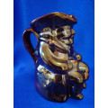 An extremely rare brown / bronze luster Toby jug by Roddy ware of Staffordshire England #