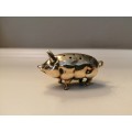 Pin cushion. A small brass pig with holes to insert your pins. English cir 1870.