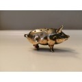 Pin cushion. A small brass pig with holes to insert your pins. English cir 1870.